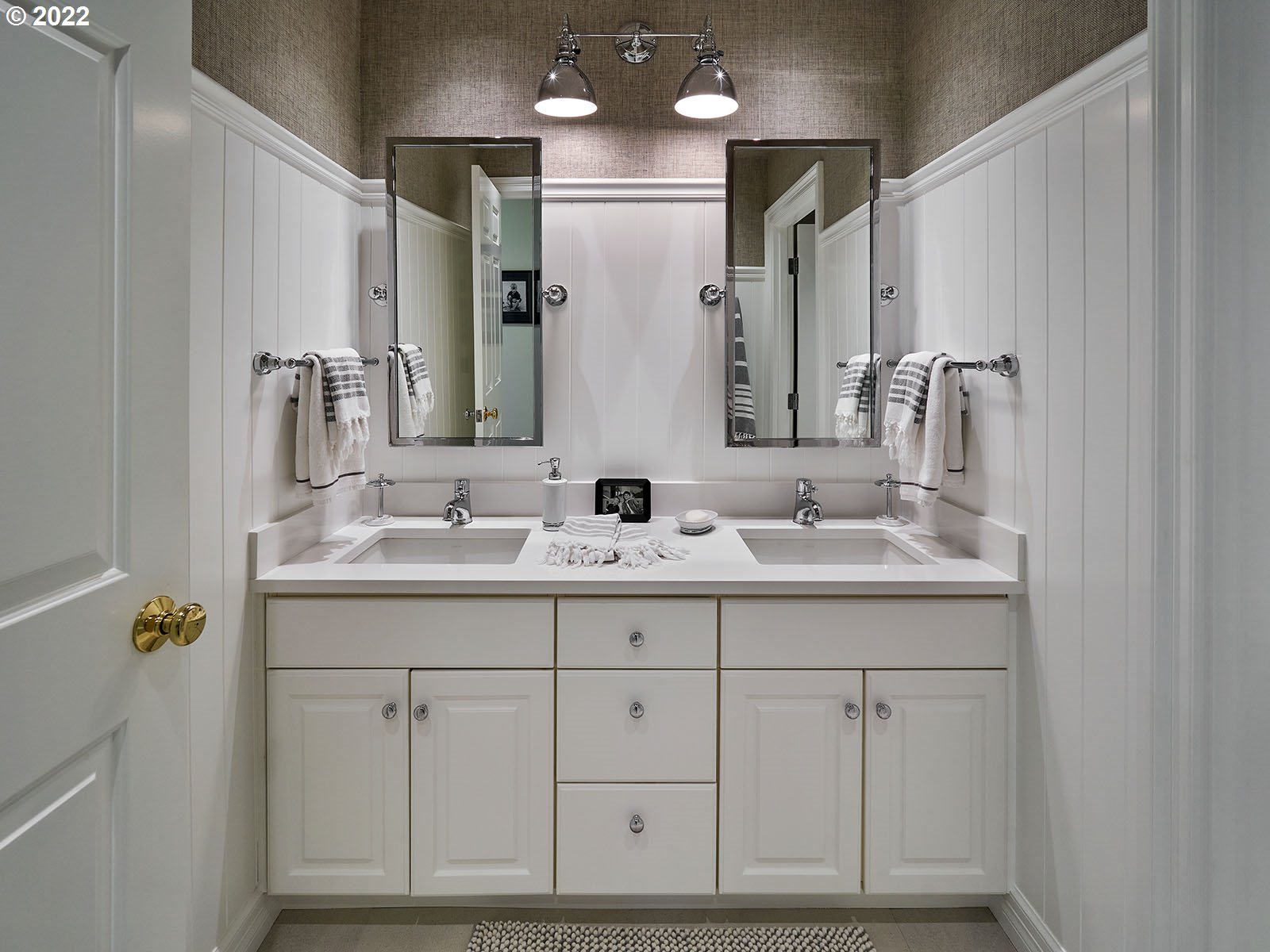 940 Southwest 67th Place Portland, OR 97225 - Photo 19 of 31 a bathroom with double sink and a mirror