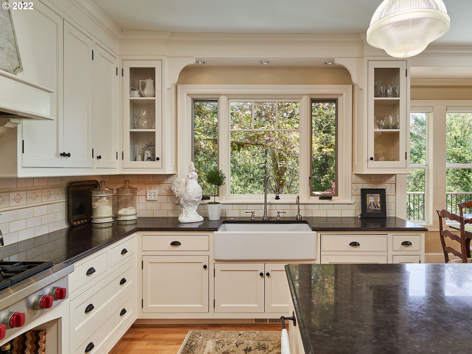 940 Southwest 67th Place Portland, OR 97225 - Photo 5 of 31 a kitchen with stainless steel appliances a stove a sink a cabinets and a large window
