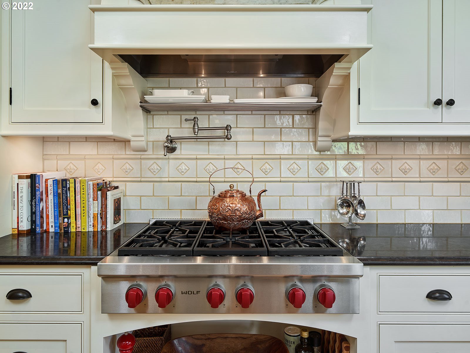 940 Southwest 67th Place Portland, OR 97225 - Photo 6 of 31 a kitchen with a stove and cabinets