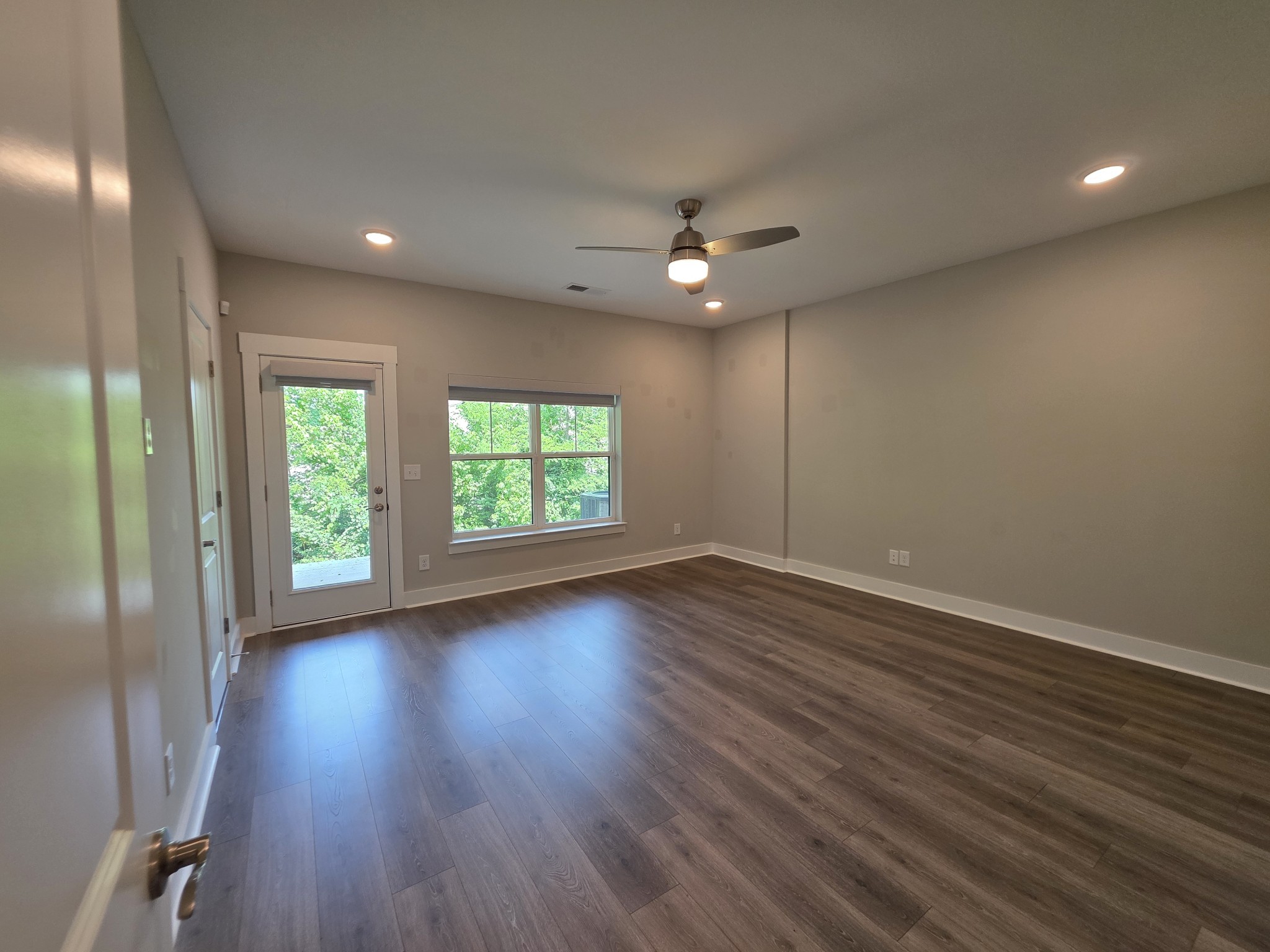 253 Stonecrest Drive Nashville, TN 37209 - Photo 31 of 36 an empty room with wooden floor and windows