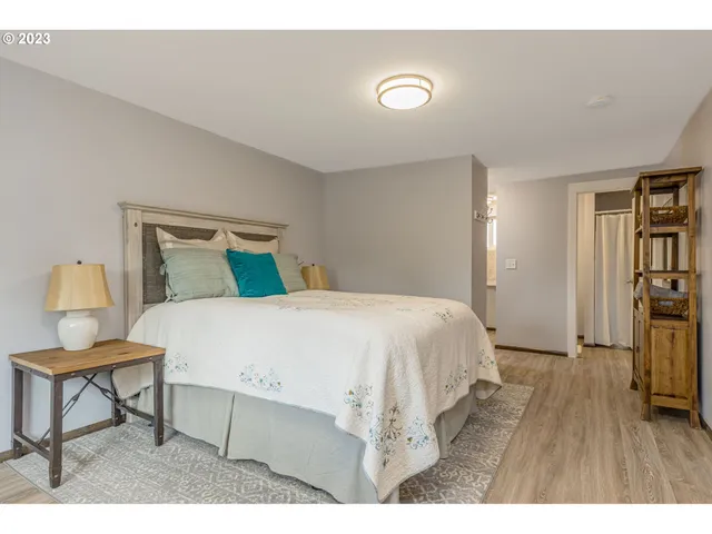 a bedroom with a bed and a table