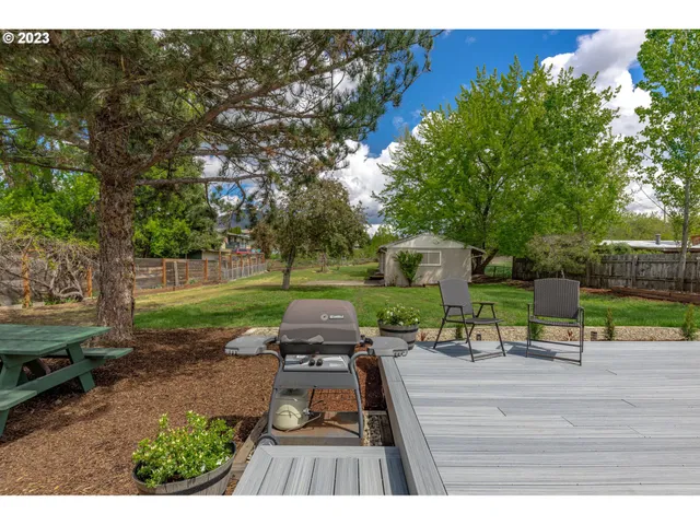 a view of a park with sitting area