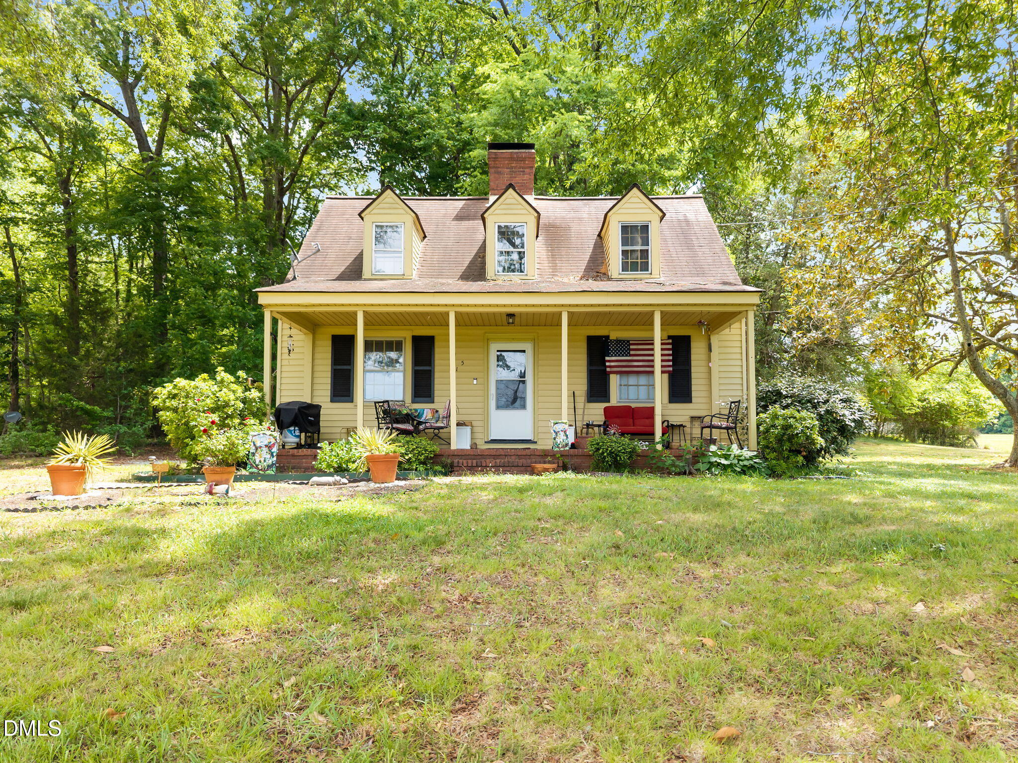 423 Quail Roost Farm Road Rougemont, NC 27572 - Photo 30 of 44 a front view of a house with swimming pool and porch