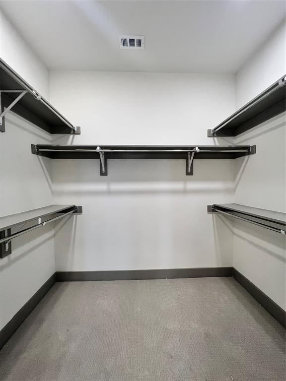 4020 McEwen Road, Unit 9123 Farmers Branch, TX 75244 - Photo 8 of 20 a kitchen with a cabinets and a dishwasher