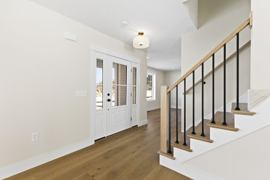 1 Haystack Lane Berkley, MA 02779 - Photo 16 of 33 a view of a hallway with wooden floor and staircase