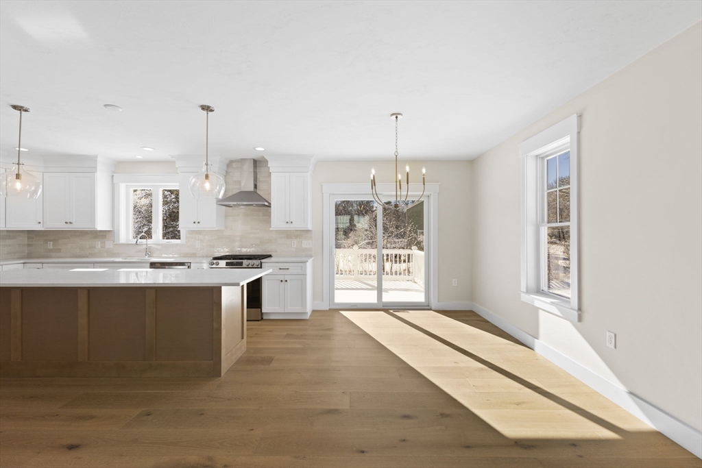 1 Haystack Lane Berkley, MA 02779 - Photo 6 of 33 a large kitchen with kitchen island a sink stainless steel appliances and cabinets