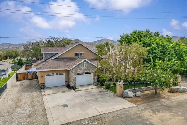 a house with trees in the background