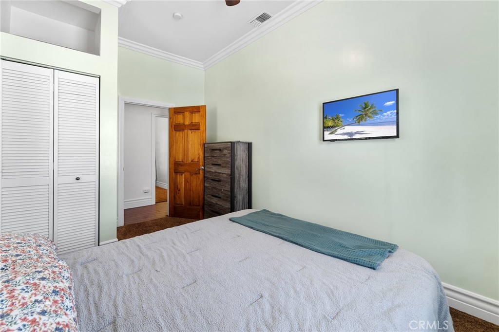 31800 3rd Street Acton, CA 93510 - Photo 17 of 47 a bedroom with a bed and wooden floor