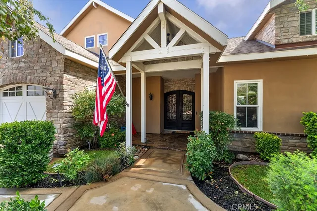 a view of a house with potted plants