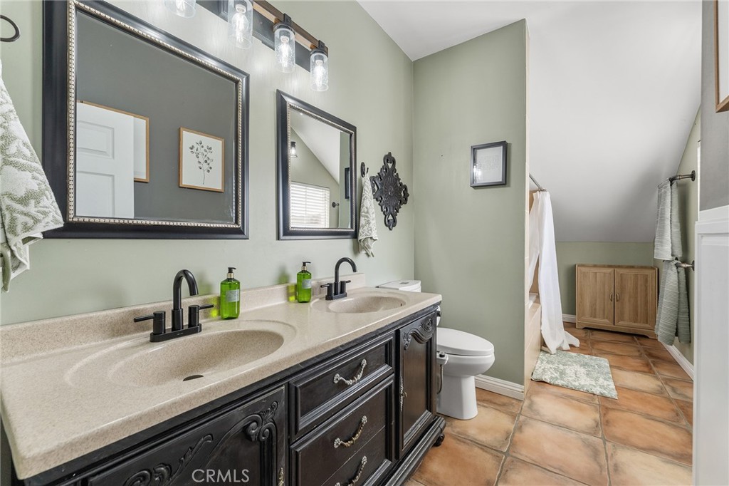 31800 3rd Street Acton, CA 93510 - Photo 29 of 47 a bathroom with a sink a toilet and a mirror