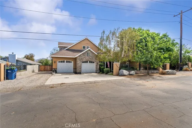 a view of a house with a yard and garage