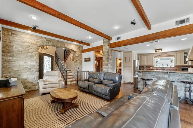 a living room with furniture and a rug