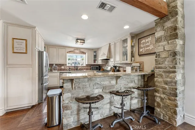 a kitchen with a sink cabinets and window