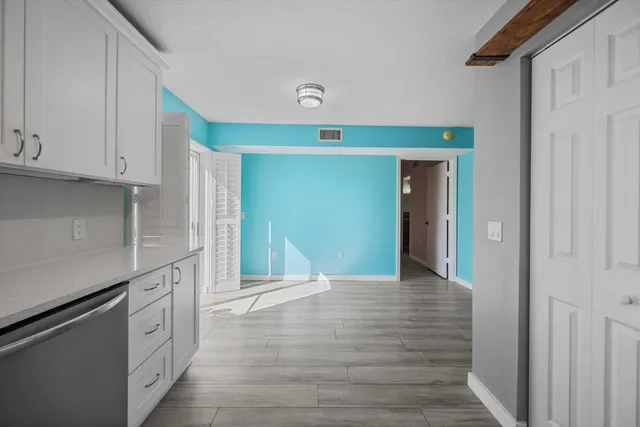 a kitchen with stainless steel appliances cabinets a sink and a stove