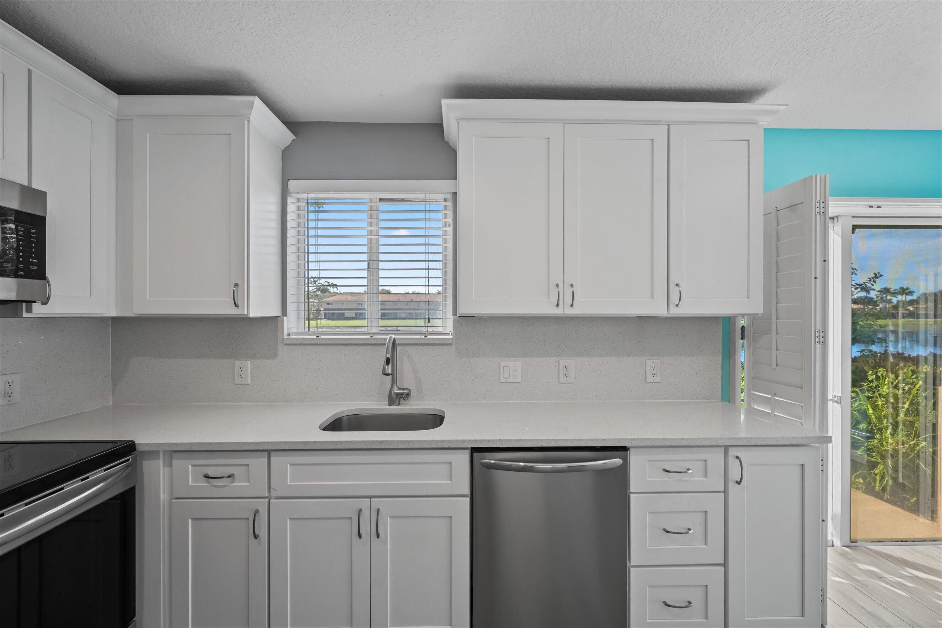 3486 Briar Bay Boulevard, Unit 101 West Palm Beach, FL 33411 - Photo 16 of 46 Kitchen