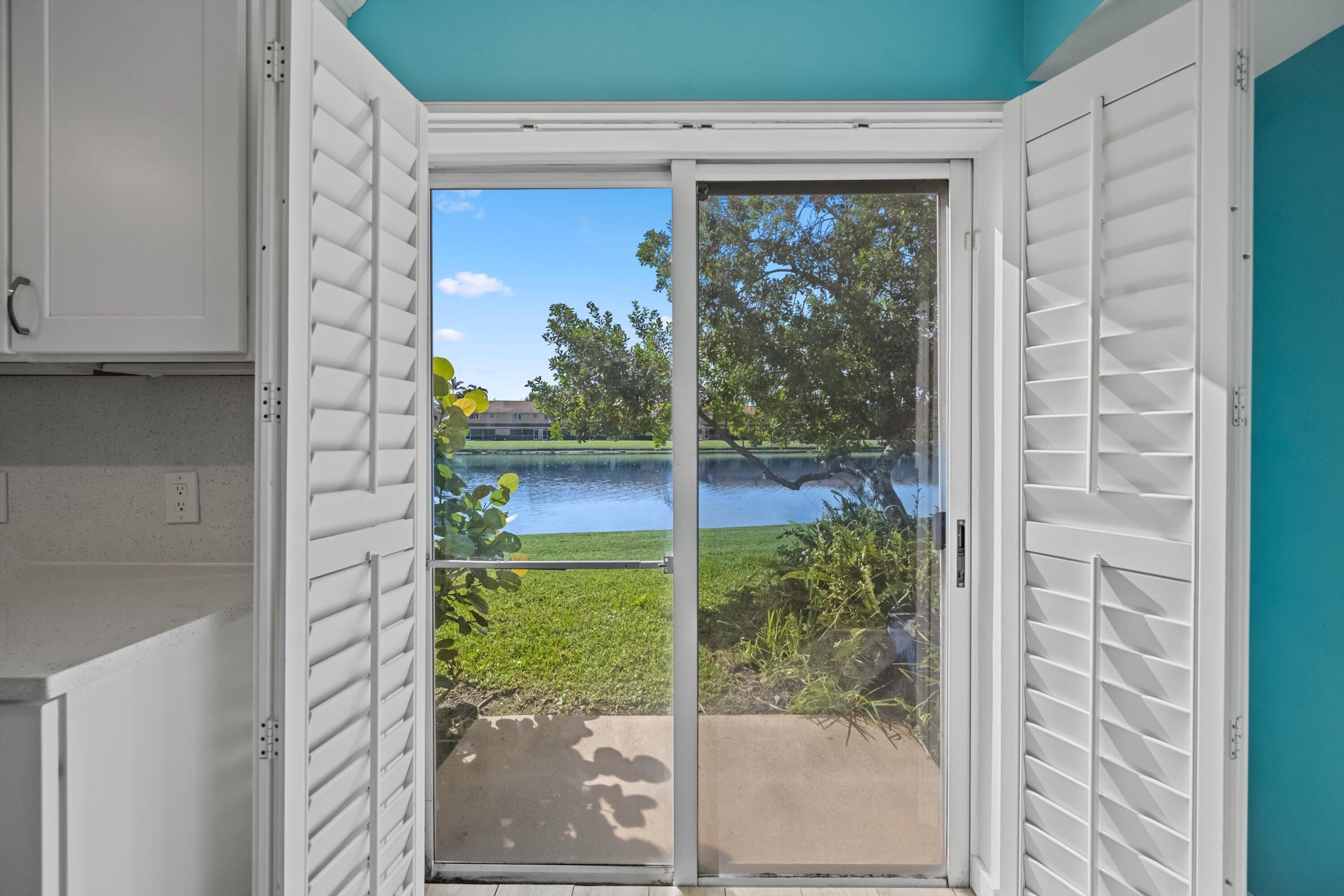 3486 Briar Bay Boulevard, Unit 101 West Palm Beach, FL 33411 - Photo 17 of 46 a view of a window of the house