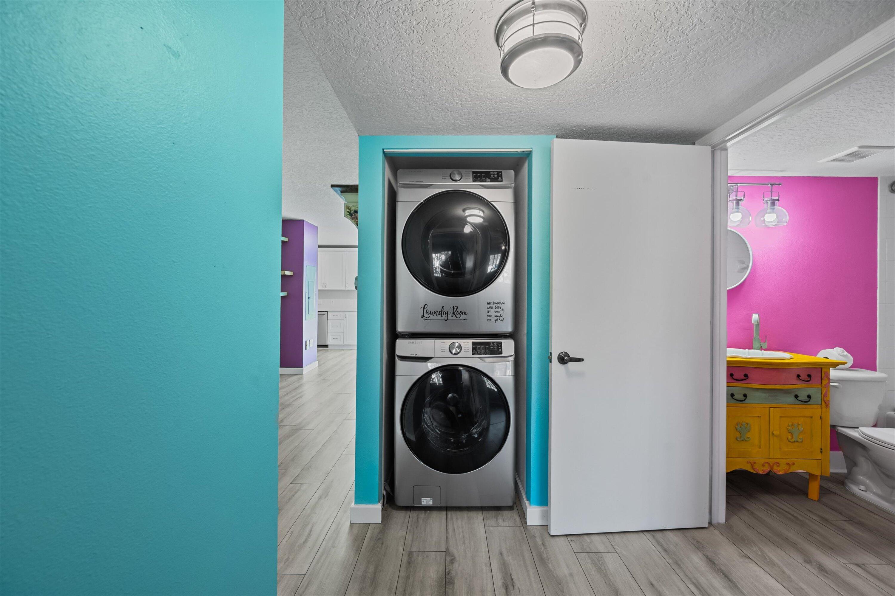 3486 Briar Bay Boulevard, Unit 101 West Palm Beach, FL 33411 - Photo 20 of 46 a utility room with wooden floor washer and dryer