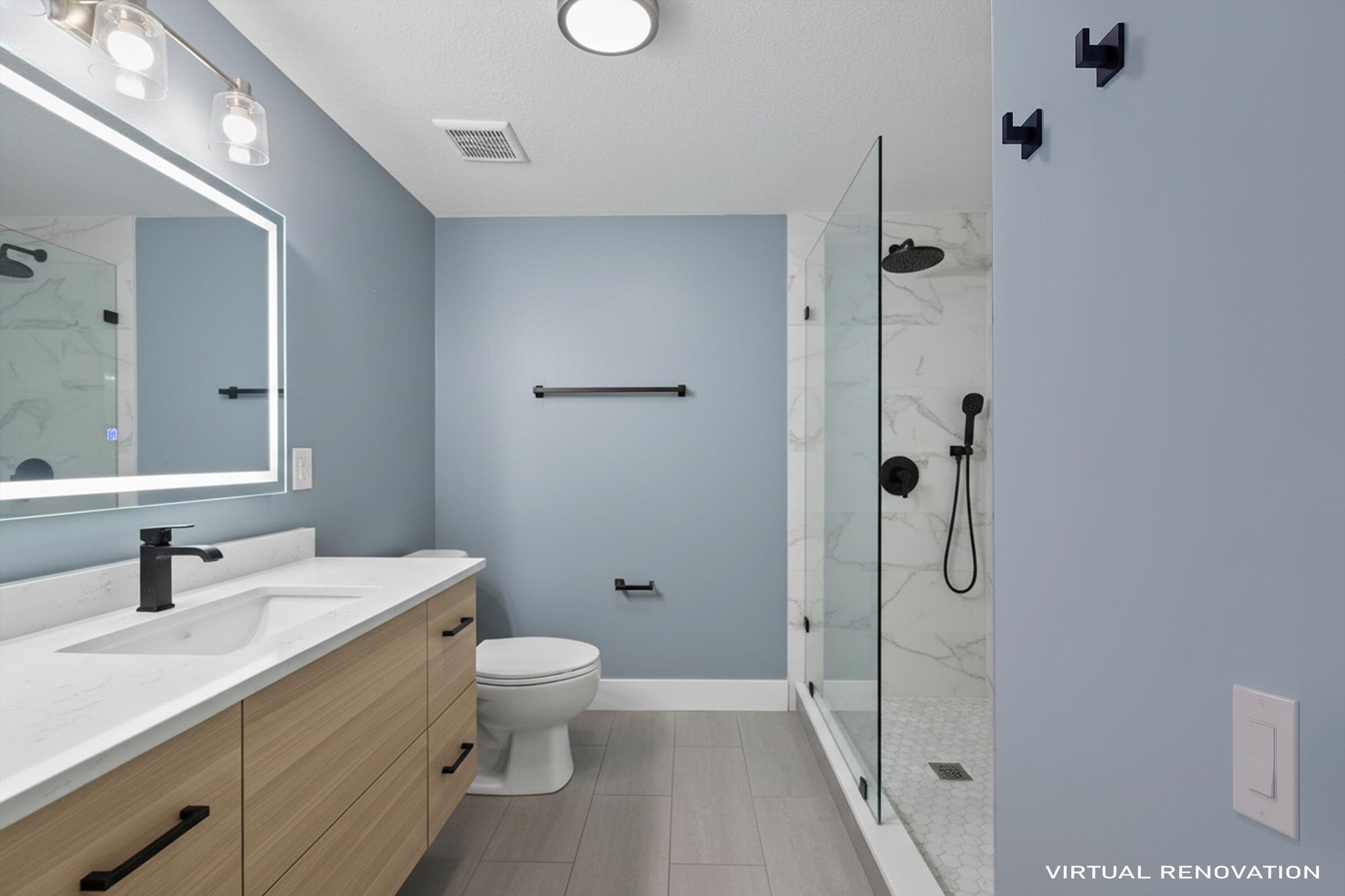 3486 Briar Bay Boulevard, Unit 101 West Palm Beach, FL 33411 - Photo 31 of 46 a bathroom with a double vanity sink toilet mirror and shower