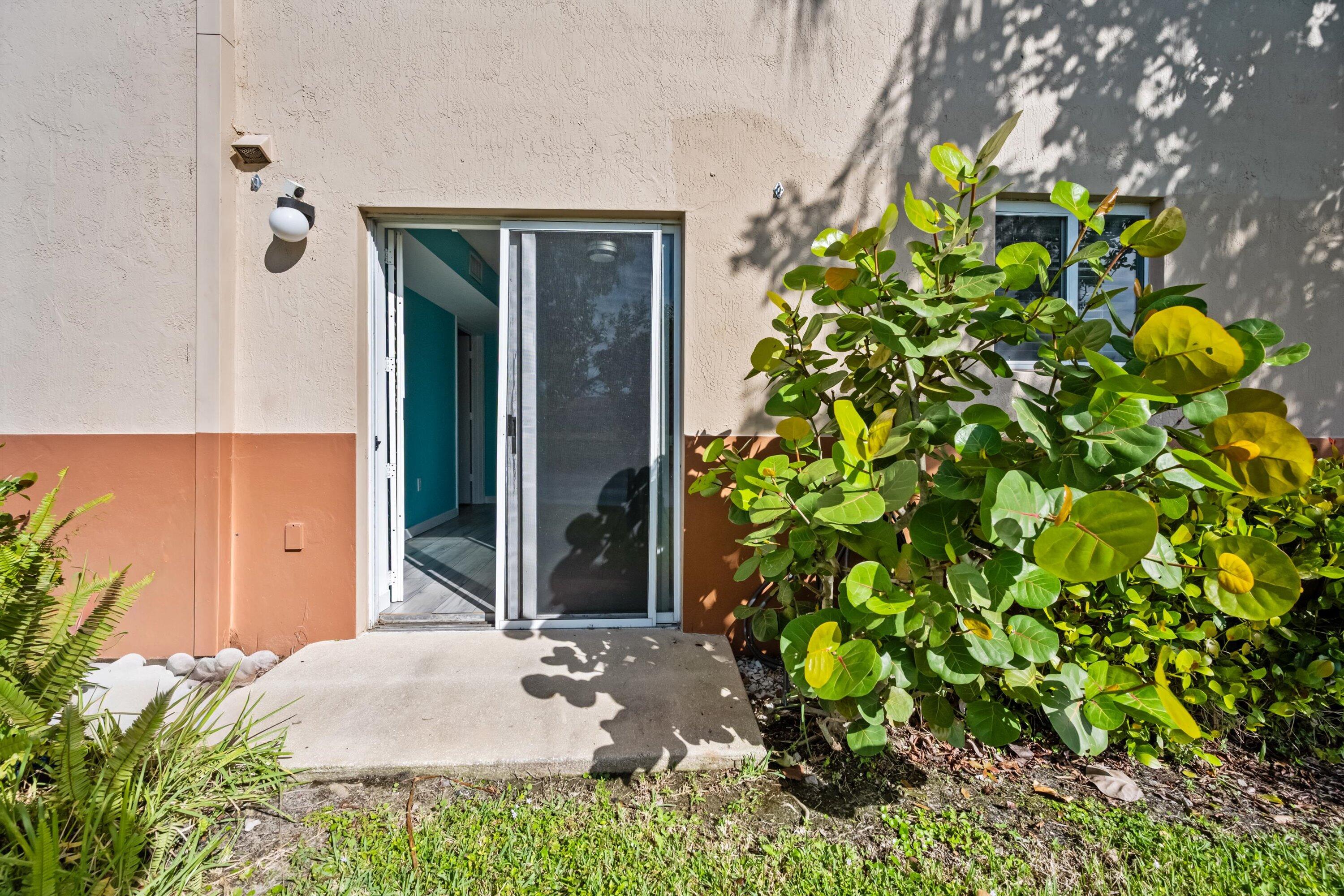 3486 Briar Bay Boulevard, Unit 101 West Palm Beach, FL 33411 - Photo 32 of 46 Back porch