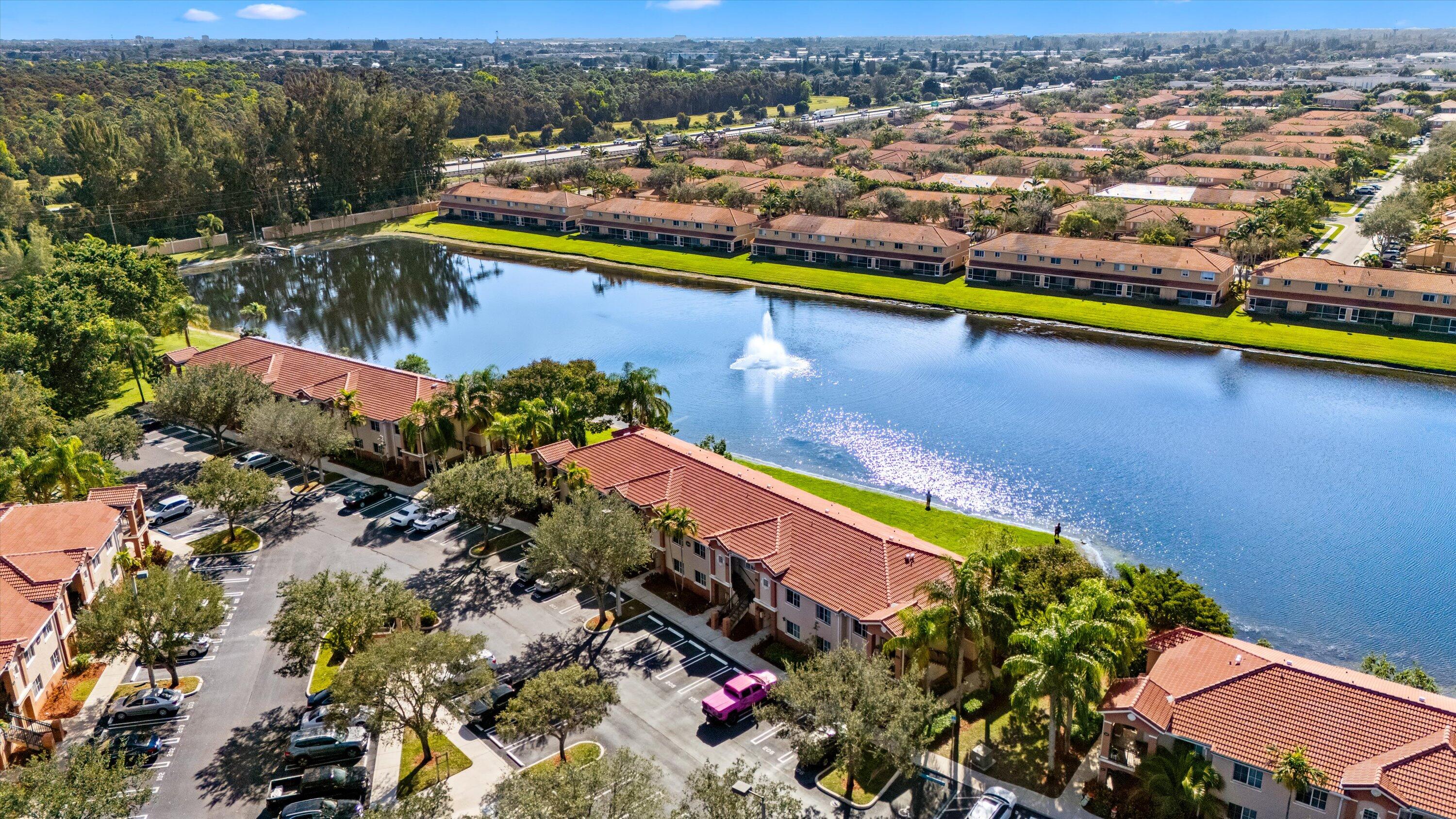 3486 Briar Bay Boulevard, Unit 101 West Palm Beach, FL 33411 - Photo 39 of 46 an aerial view of residential houses with outdoor space and swimming pool
