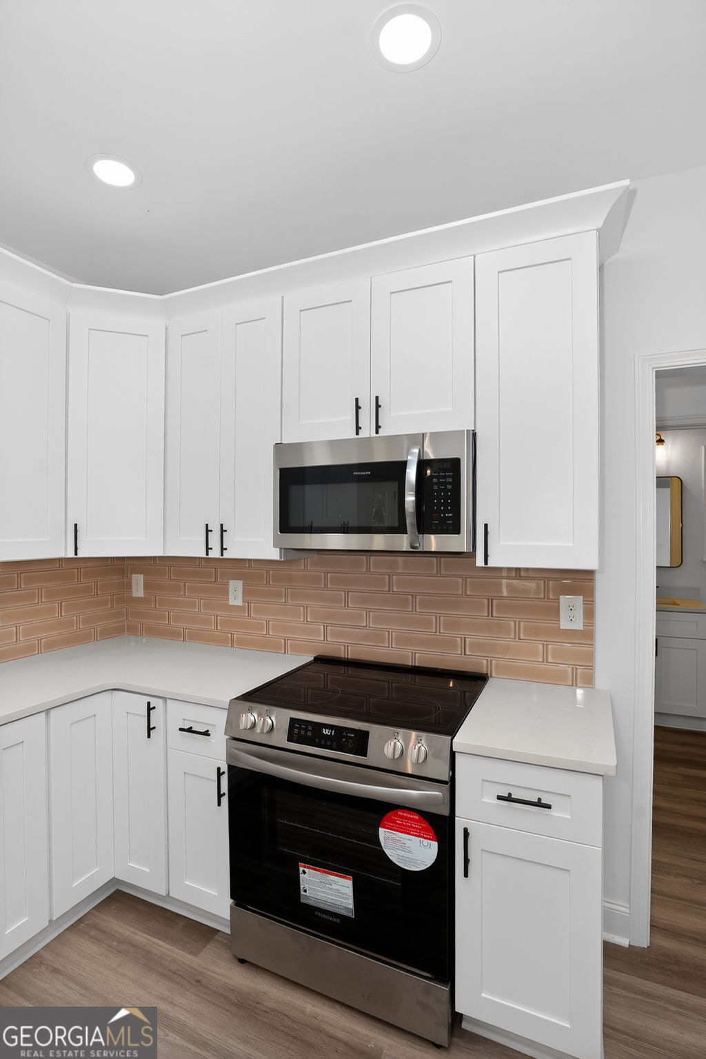 1229 Chappell Mill Road Jackson, GA 30233 - Photo 28 of 55 a kitchen with a stove and a sink