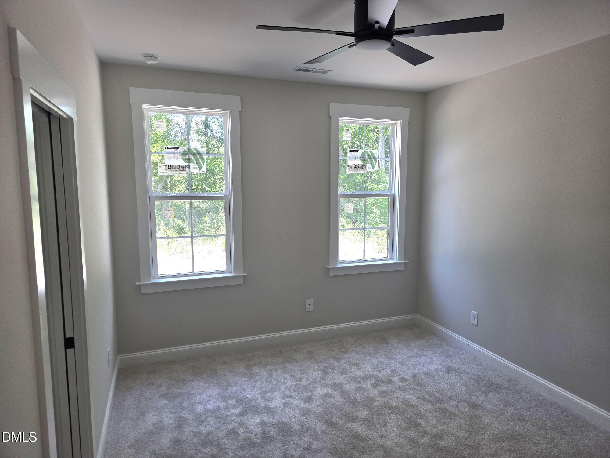 300 Avery Road Erwin, NC 28339 - Photo 18 of 38 an empty room with a window and a fan