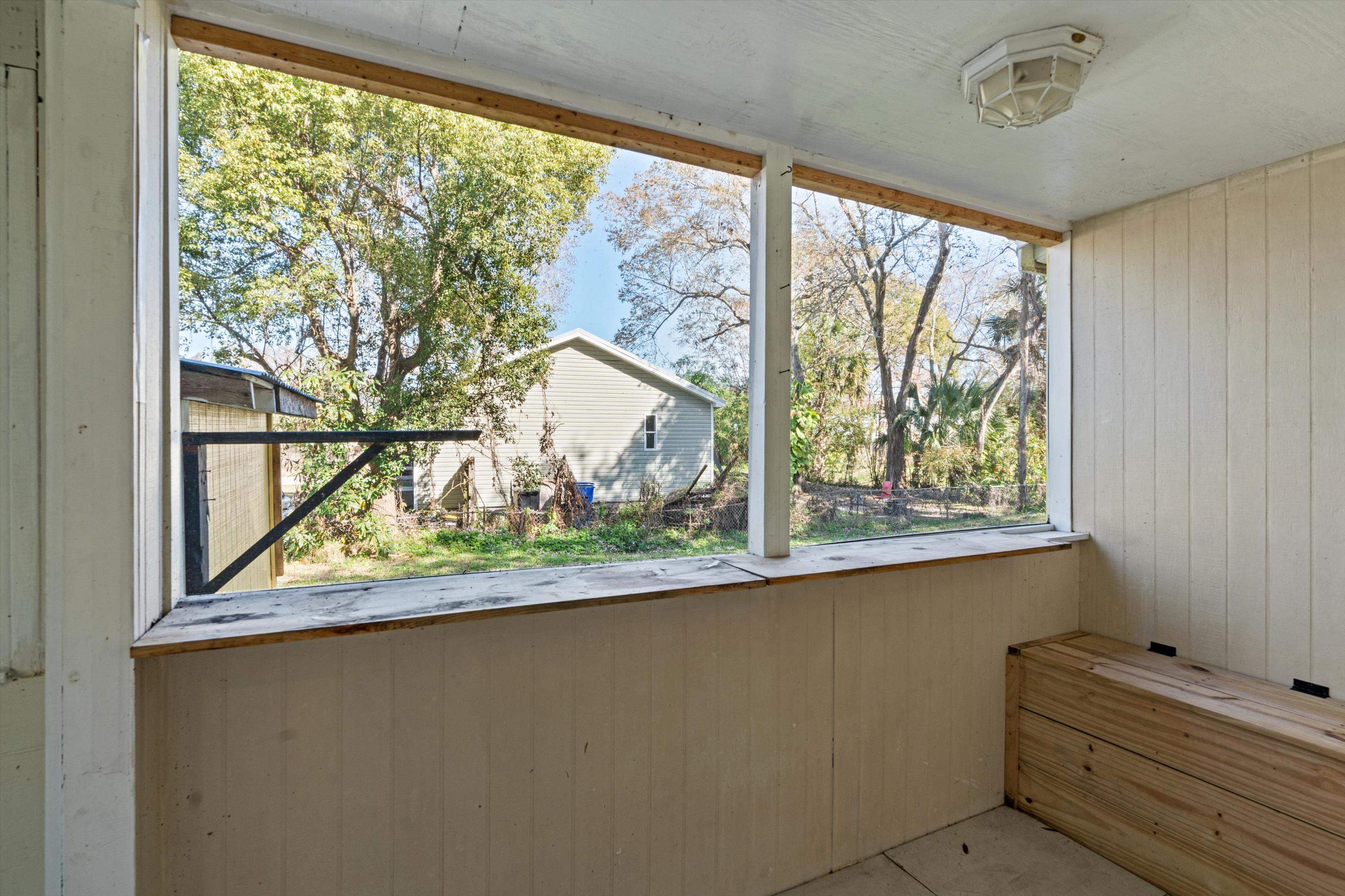 4588 First Avenue St. Augustine, FL 32095 - Photo 12 of 25 a view of a hardwood floor and a large window