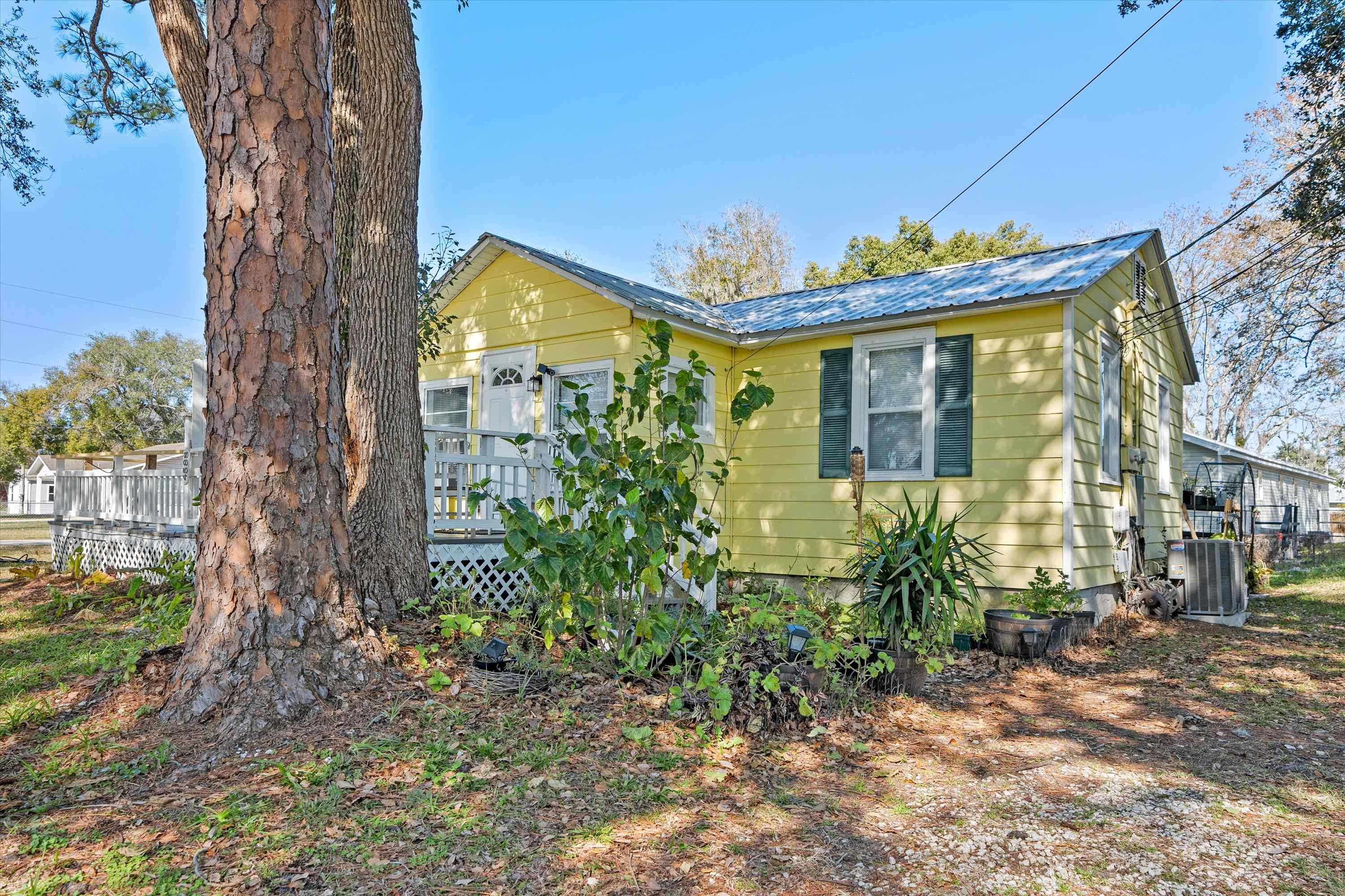 4588 First Avenue St. Augustine, FL 32095 - Photo 13 of 25 a front view of a house with a yard