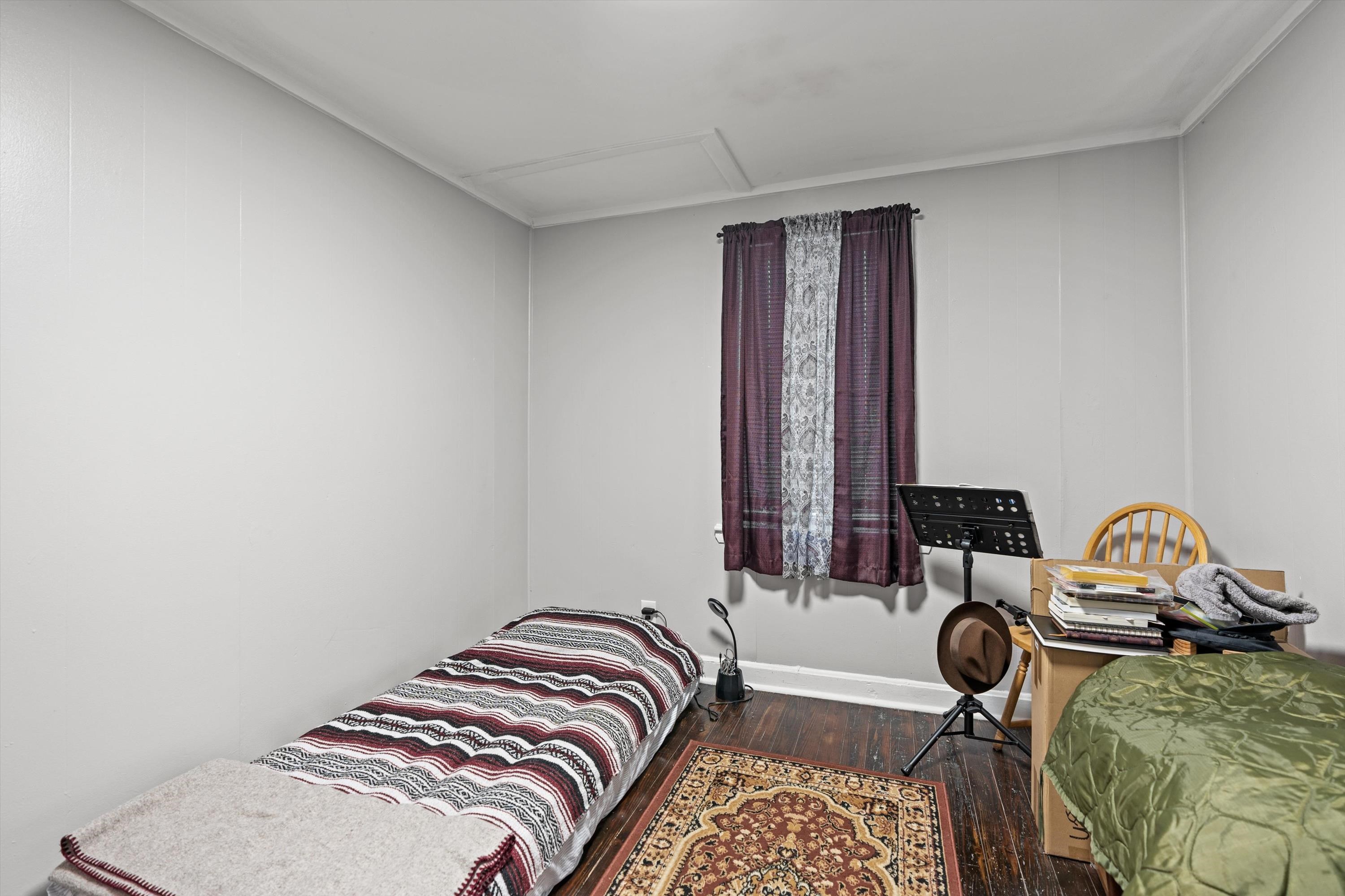 4588 First Avenue St. Augustine, FL 32095 - Photo 16 of 25 a bedroom with a bed and a window