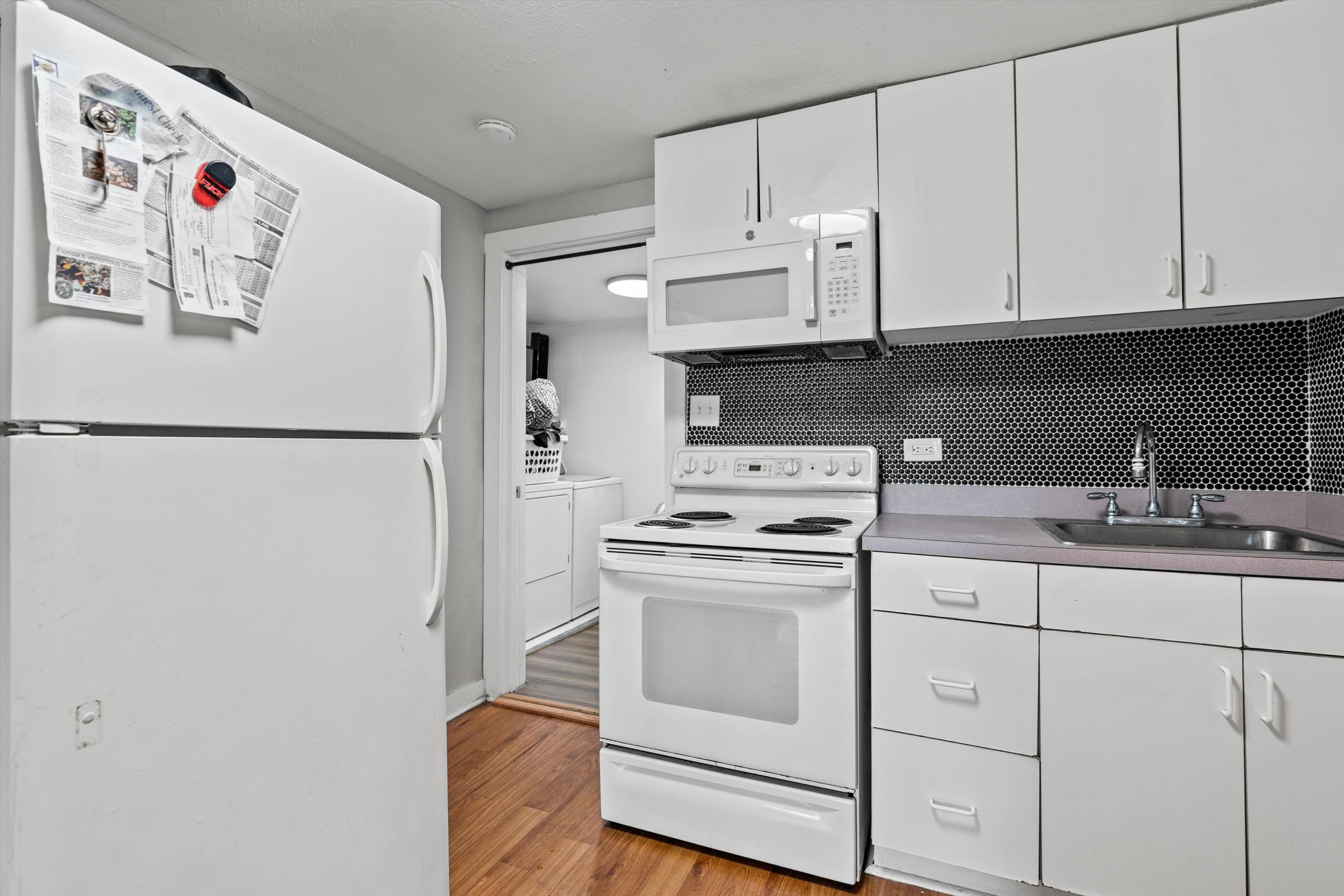 4588 First Avenue St. Augustine, FL 32095 - Photo 18 of 25 a white refrigerator freezer sitting inside of a kitchen