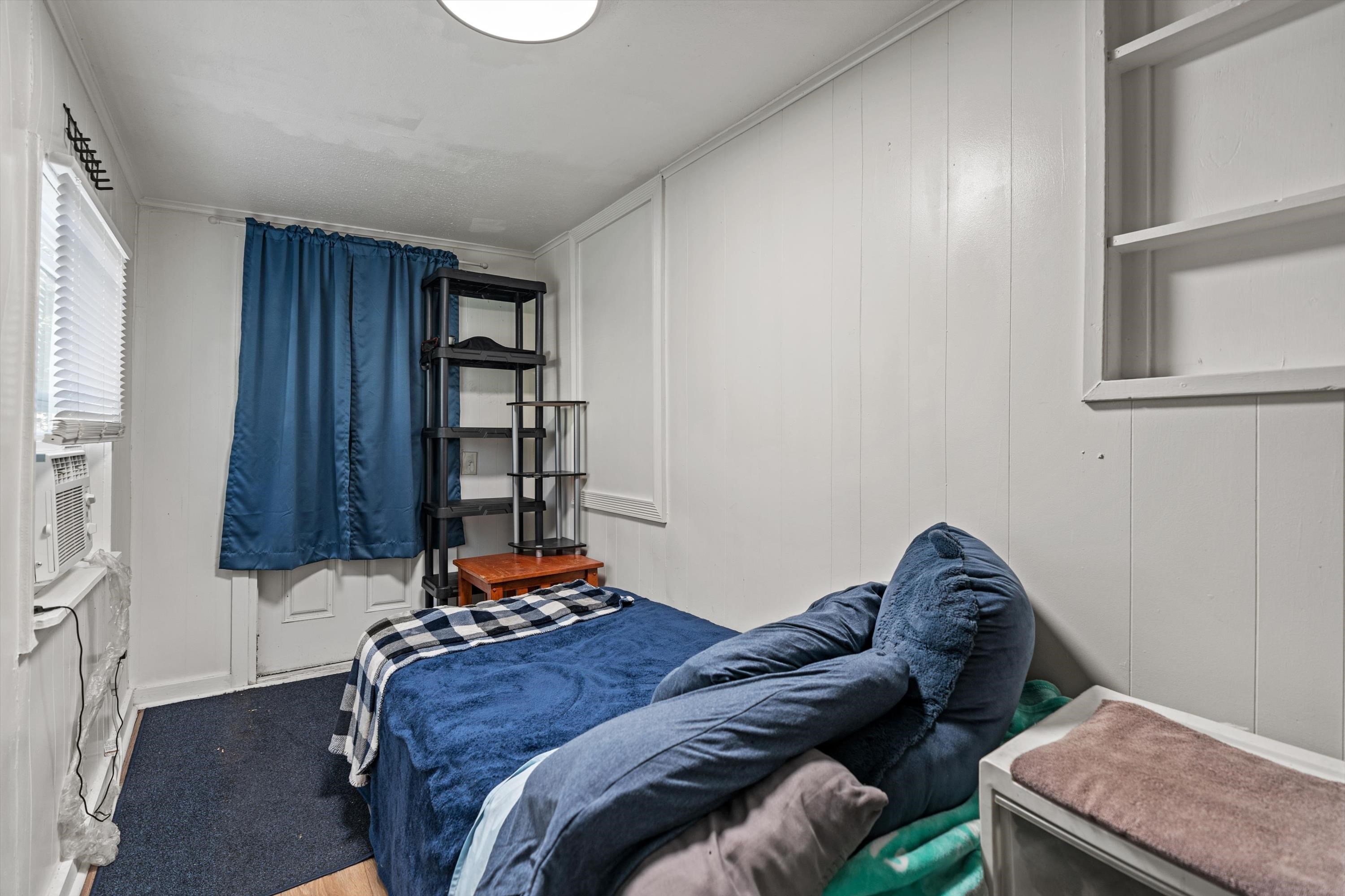 4588 First Avenue St. Augustine, FL 32095 - Photo 22 of 25 a bedroom with a bed and a window