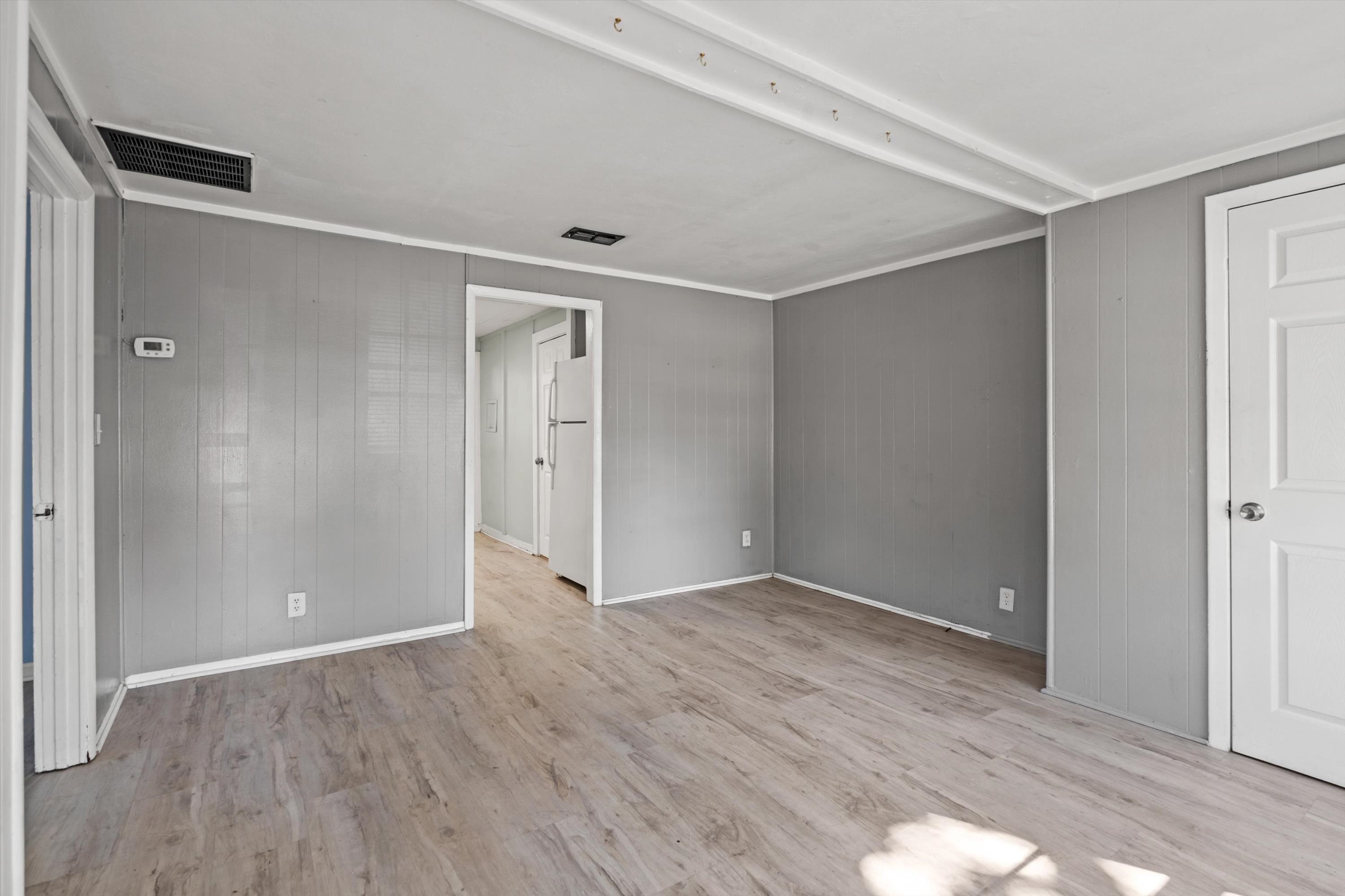 4588 First Avenue St. Augustine, FL 32095 - Photo 3 of 25 a view of an empty room with wooden floor