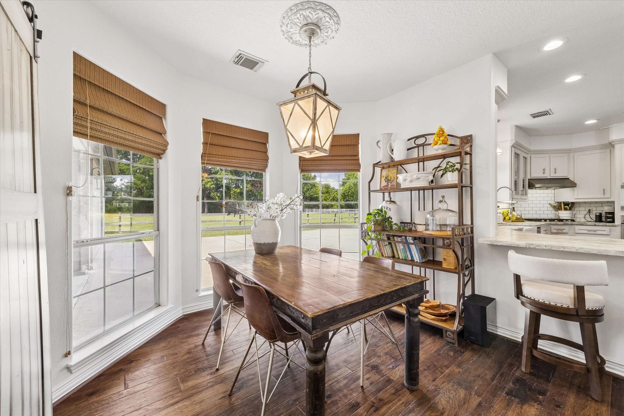 6819 Still Meadow Street Spring, TX 77389 - Photo 24 of 50 The sunny breakfast room is the perfect place to start your day, overlooking the pretty barn and lovely landscape to the right of the house