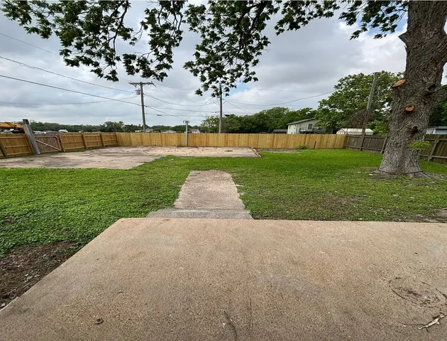 a view of a park with large trees
