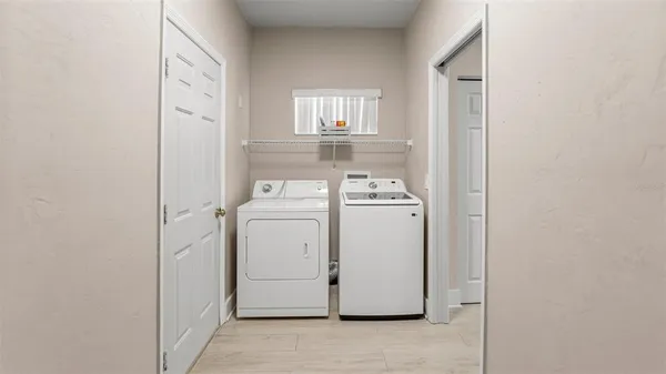 a utility room with dryer and washer
