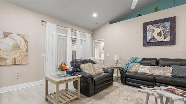 a living room with furniture and a large window