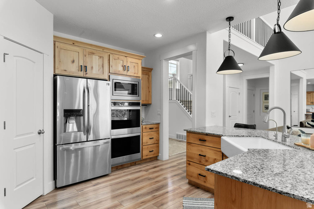 500 North 516th Street West, Unit 19 Mapleton, UT 84664 - Photo 6 of 41 Kitchen featuring wood-finish flooring and light wood cabinetry