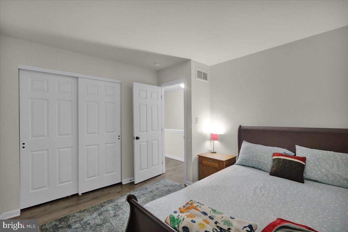 383 Oneida Drive Reading, PA 19608 - Photo 13 of 27 a bedroom with a bed and a night stand