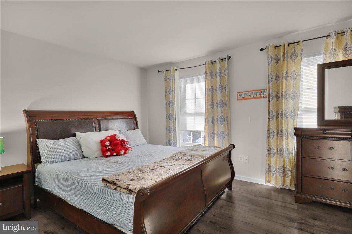 383 Oneida Drive Reading, PA 19608 - Photo 14 of 27 a bedroom with a bed and wooden floor