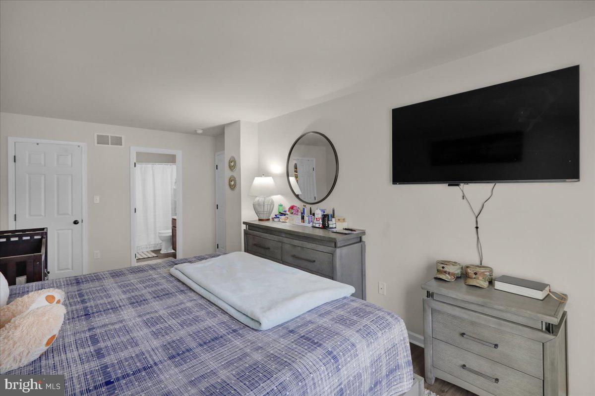 383 Oneida Drive Reading, PA 19608 - Photo 21 of 27 a bedroom with a bed and a flat screen tv