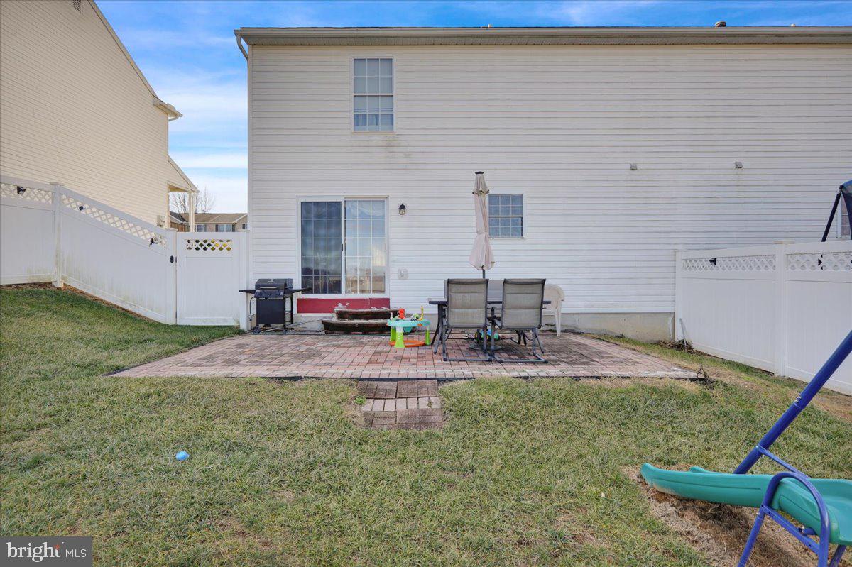 383 Oneida Drive Reading, PA 19608 - Photo 24 of 27 a backyard of a house with seating space
