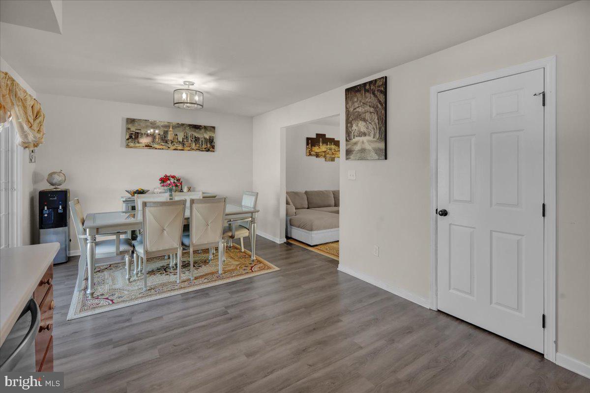 383 Oneida Drive Reading, PA 19608 - Photo 9 of 27 a view of a dining room with furniture and wooden floor