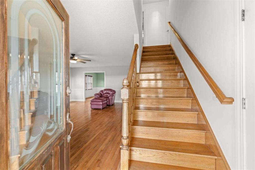 131 Caudell Drive Lula, GA 30554 - Photo 15 of 45 a view of a hallway with wooden floor and staircase