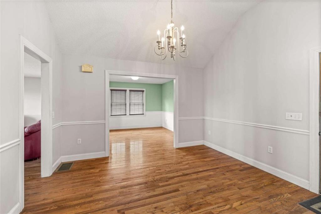 131 Caudell Drive Lula, GA 30554 - Photo 21 of 45 wooden floor in an empty room with a window