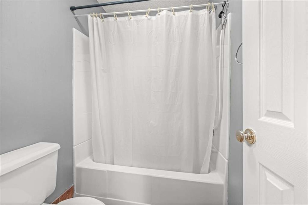 131 Caudell Drive Lula, GA 30554 - Photo 33 of 45 a bathroom with a shower and a toilet