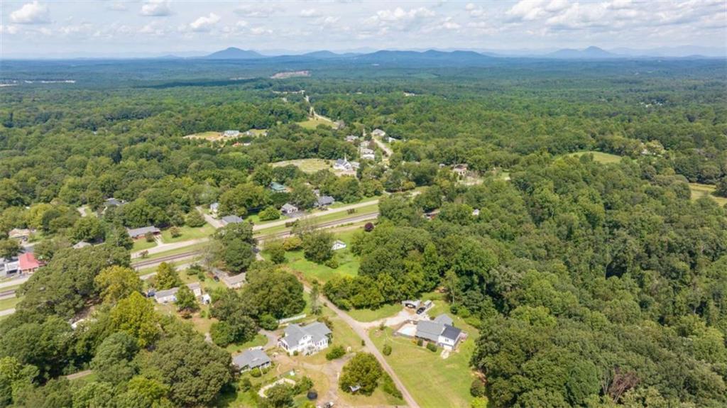 131 Caudell Drive Lula, GA 30554 - Photo 10 of 45 a view of a green field with lots of bushes