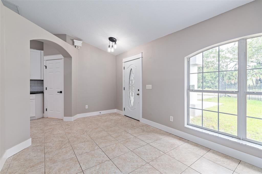 4191 Canal Avenue Bunnell, FL 32110 - Photo 15 of 81 a view of an empty room with window and chandelier fan