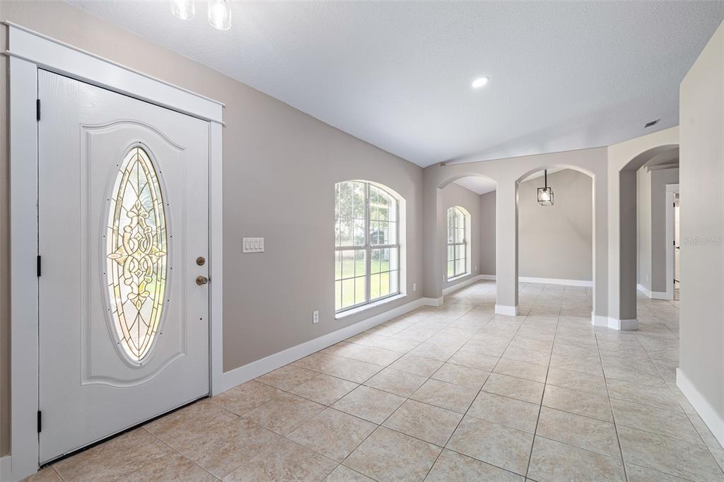 4191 Canal Avenue Bunnell, FL 32110 - Photo 16 of 81 a view of a hallway with entryway and front door