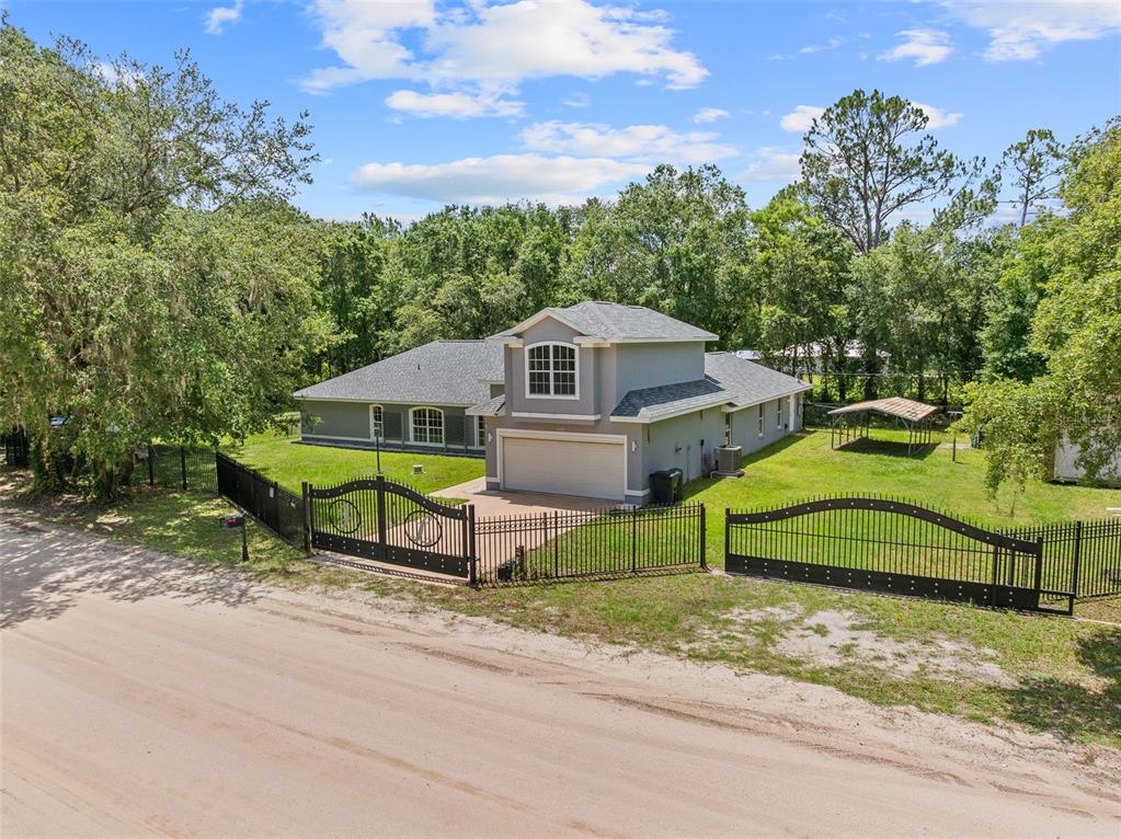 4191 Canal Avenue Bunnell, FL 32110 - Photo 3 of 81 an aerial view of a house with a yard and sitting area
