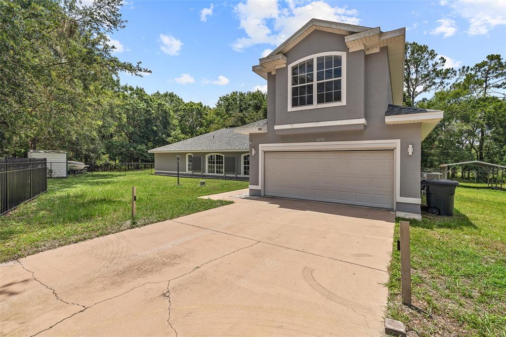 4191 Canal Avenue Bunnell, FL 32110 - Photo 4 of 81 a front view of a house with garden